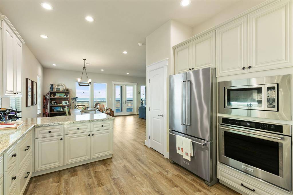 Kitchen has stainless steel appliances. Refrigerator stays!