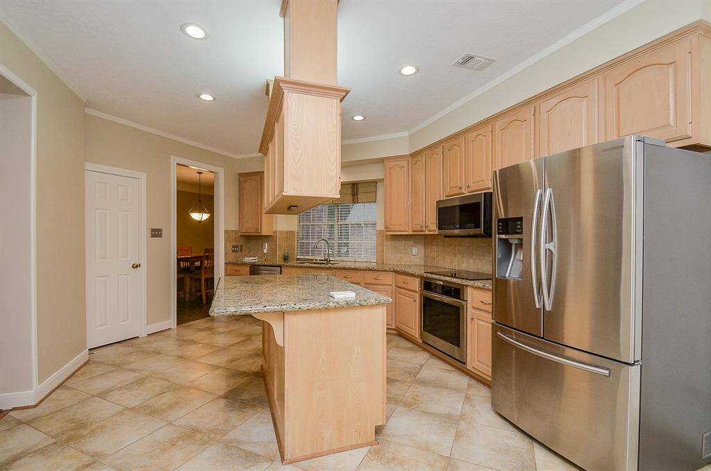 Stainless steel refrigerator stays with the home!