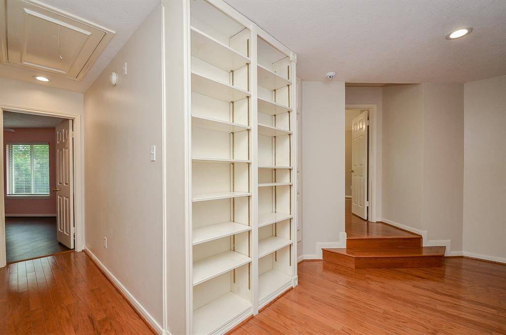 At the top of the stairs is the primary room to the right and the secondary rooms to the left.