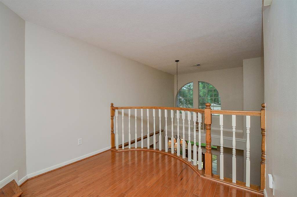 A Juliet balcony just off of the primary bedroom adds such a nice touch to the space.