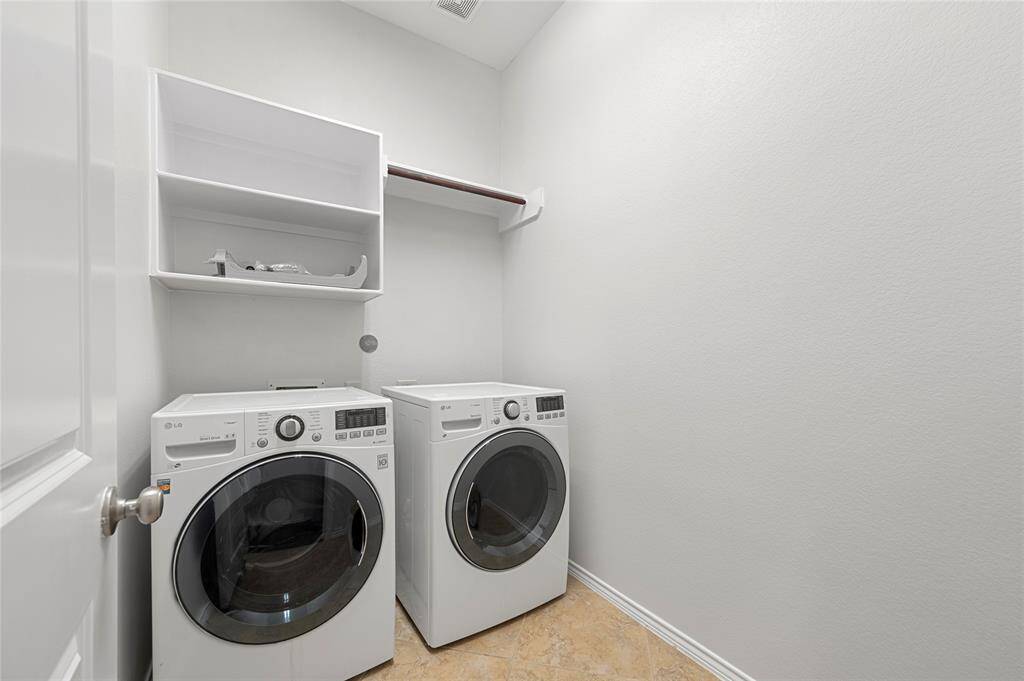 Laundry Room with an extra room with shelves right next to it