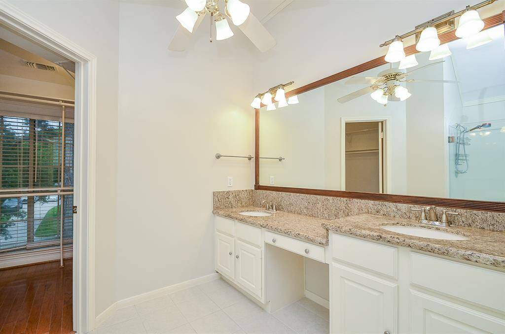 Double vanities with an extra long mirror and vanity area for getting ready.
