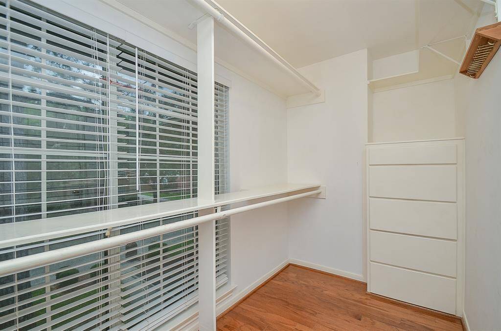 There are 2 closets in the primary room; this one has a window which gives off natural light.