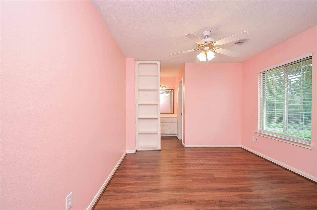To the left of the staircase at the end of the hallway is bedroom 2 with a jack and jill bathroom.