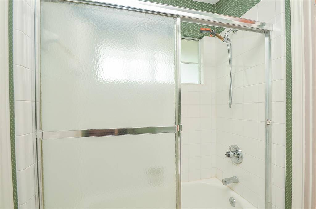 The shower and commode are in a separate room and shared betwen bedroom 2 and 3.