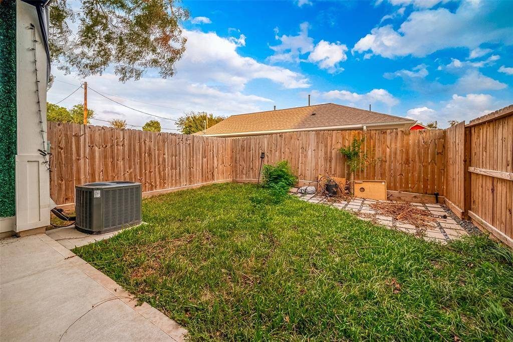 Step out in the fenced in backyard and covered patio area.