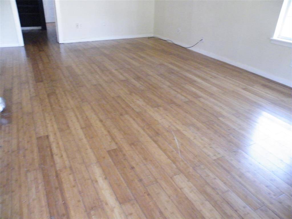 Good sized living room with laminate wood floor