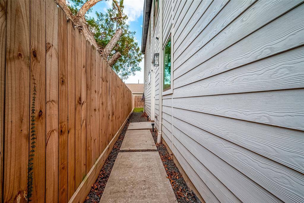 Front door is down the side past a secure pedestrian gate.