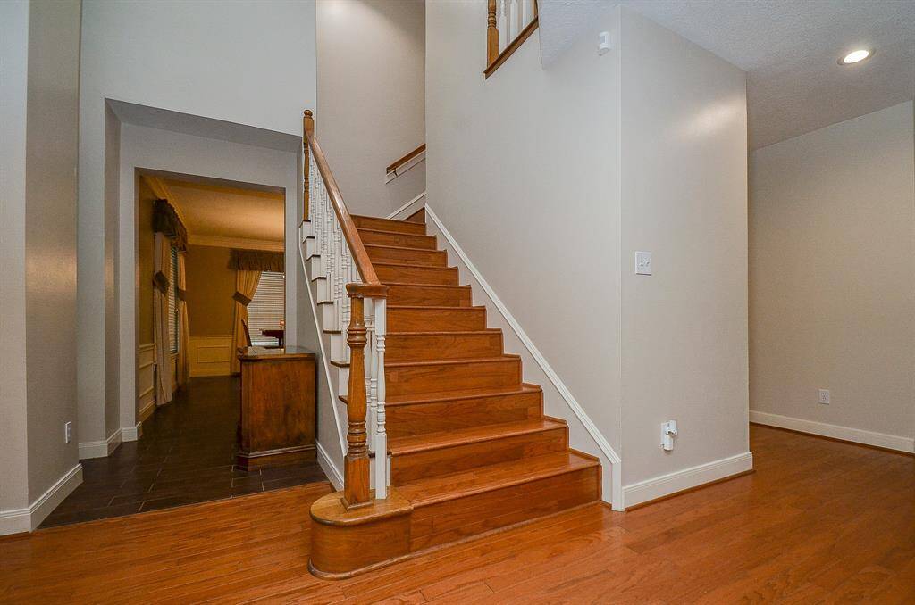 As you enter into this stunning home, the high ceilings and grand foyer welcomes you.