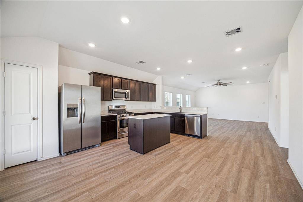 The kitchen also features an island perfect for food preparation and entertaining.