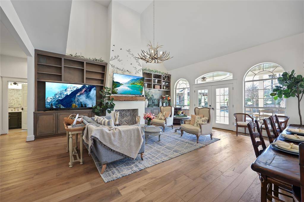 Another angle of the same beautifully designed living space. The large built in custom entertainment cabinetry  hug the fireplace allowing for style and functionality.