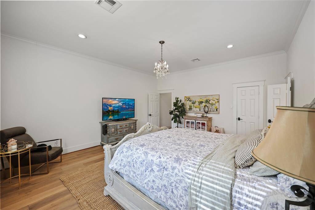The space is thoughtfully arranged with room for a cozy seating area and more.