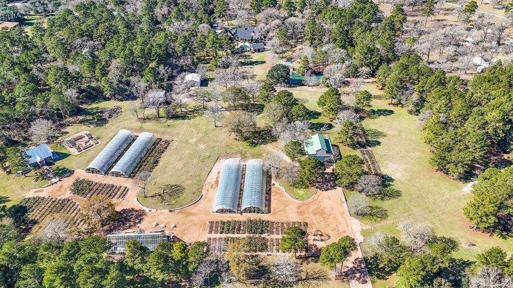 Directly behind the homestead are @10-acres that is currently a rose farm: Life in Rose Farm. This space is also used as a wedding event venue and has a 900 sqft French cottage on it. This is for sale, is unrestricted and ag-exempt.