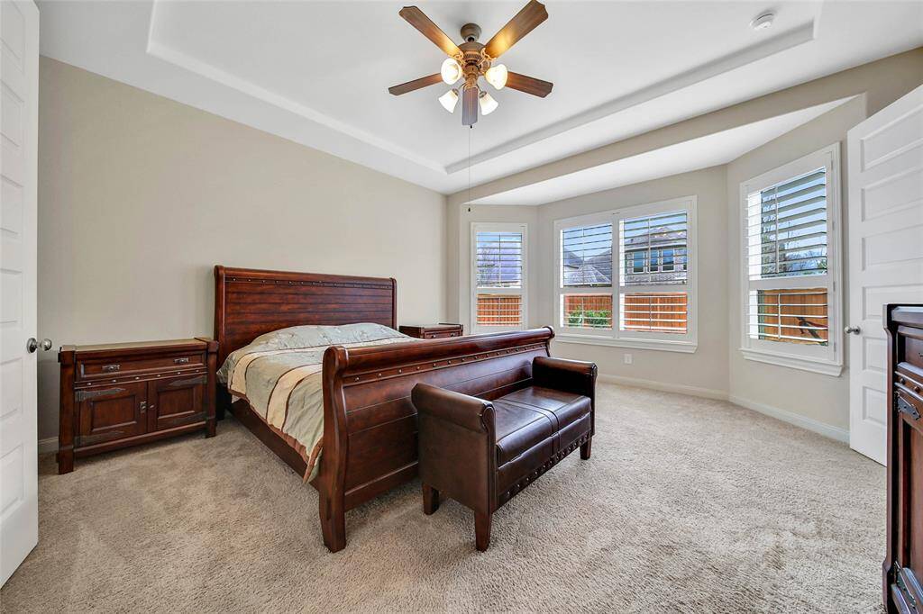 Nestled at the back of the home is the large owner's suite.
