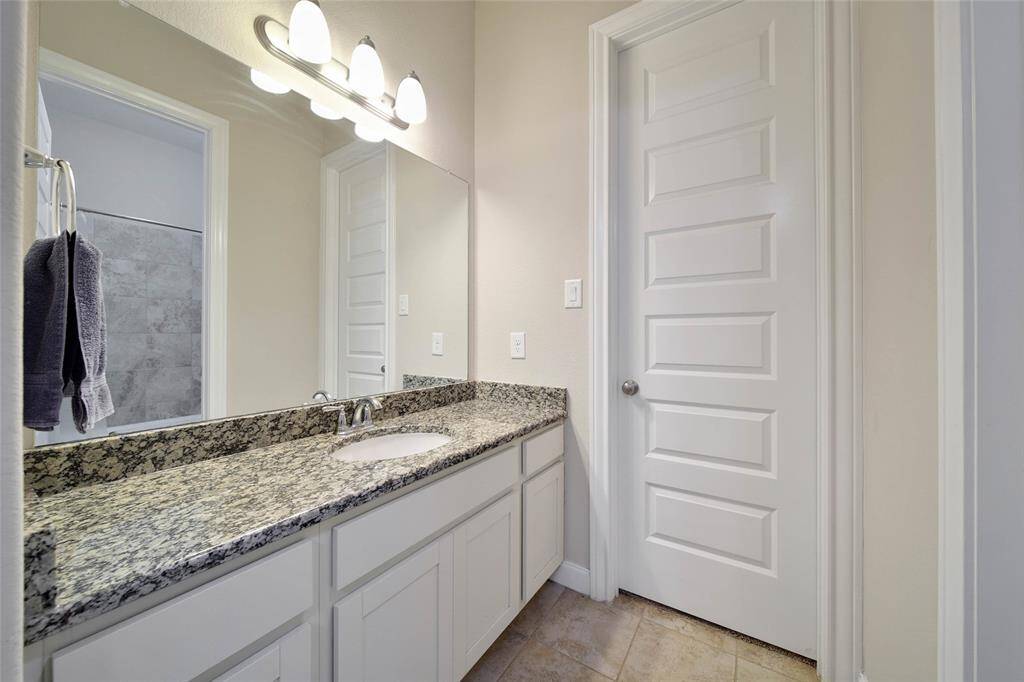 The half bath is conveniently located off the family room for guests.