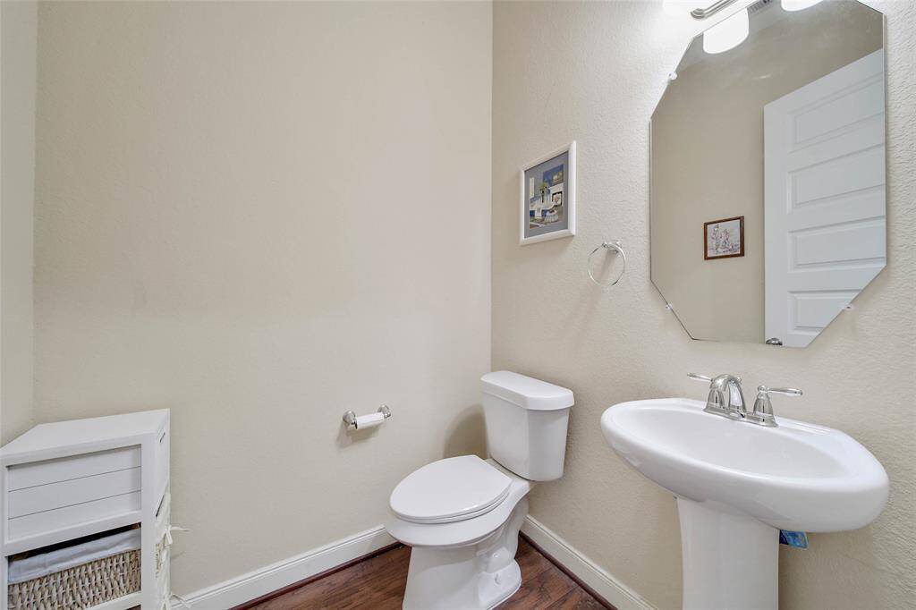The half bath is conveniently located off the family room for guests.