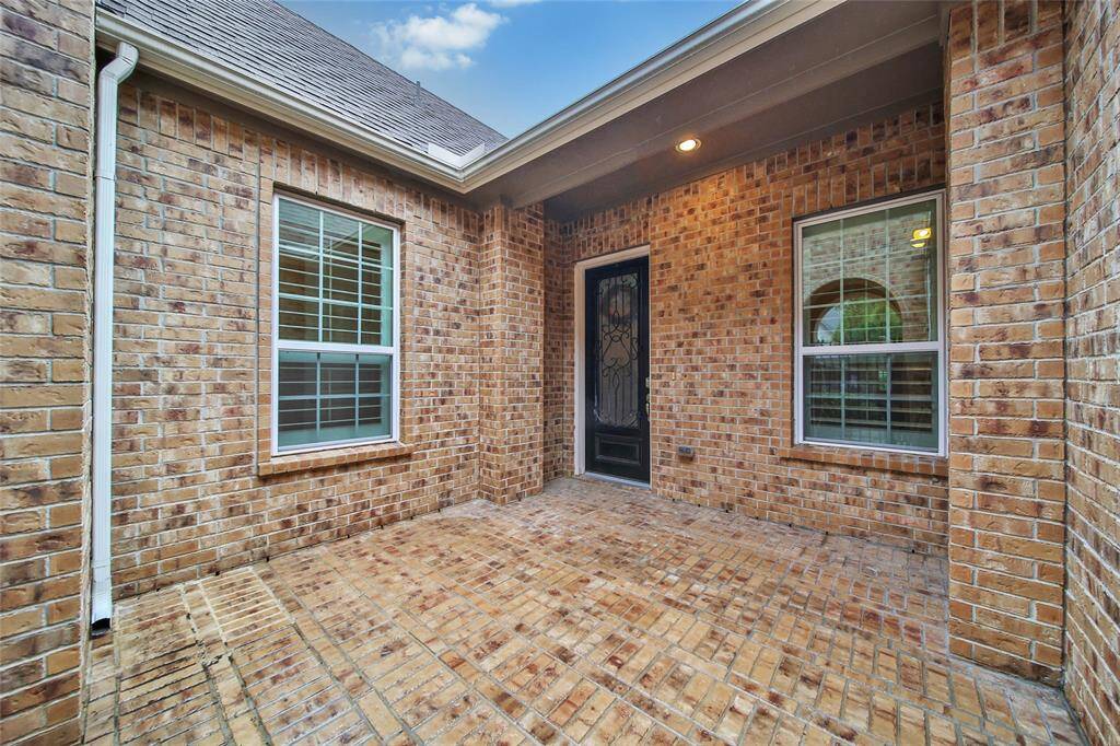 This is a charming space for welcoming guests and a space to enjoy your morning coffee or herb garden.