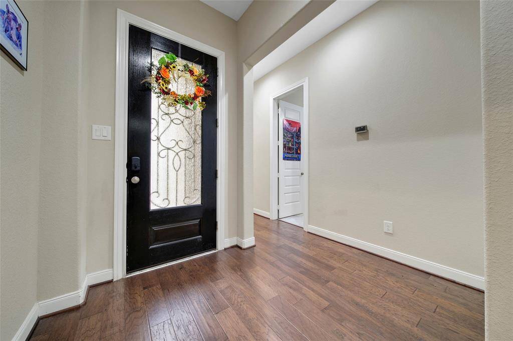 The entry is beautiful and open. New door locks with a fingerprint scanner were added to the front and back doors.
