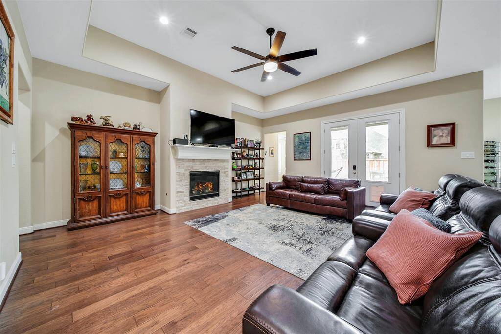 The family room easily accommodates large furniture with many layout options.