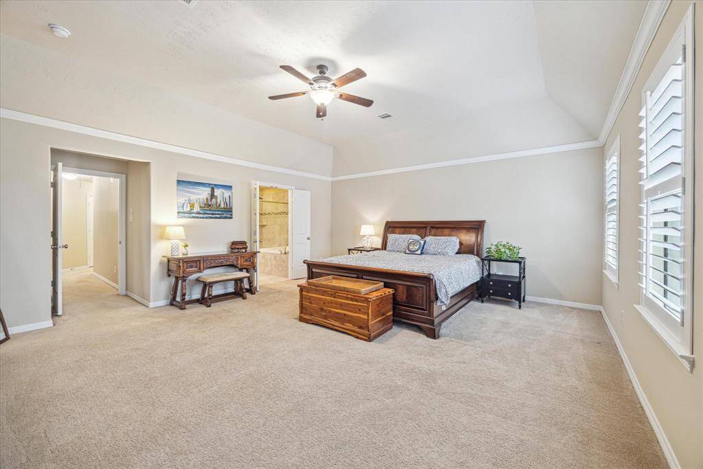 The large primary bedroom can easily accommodate a California king bed with two nightstands.