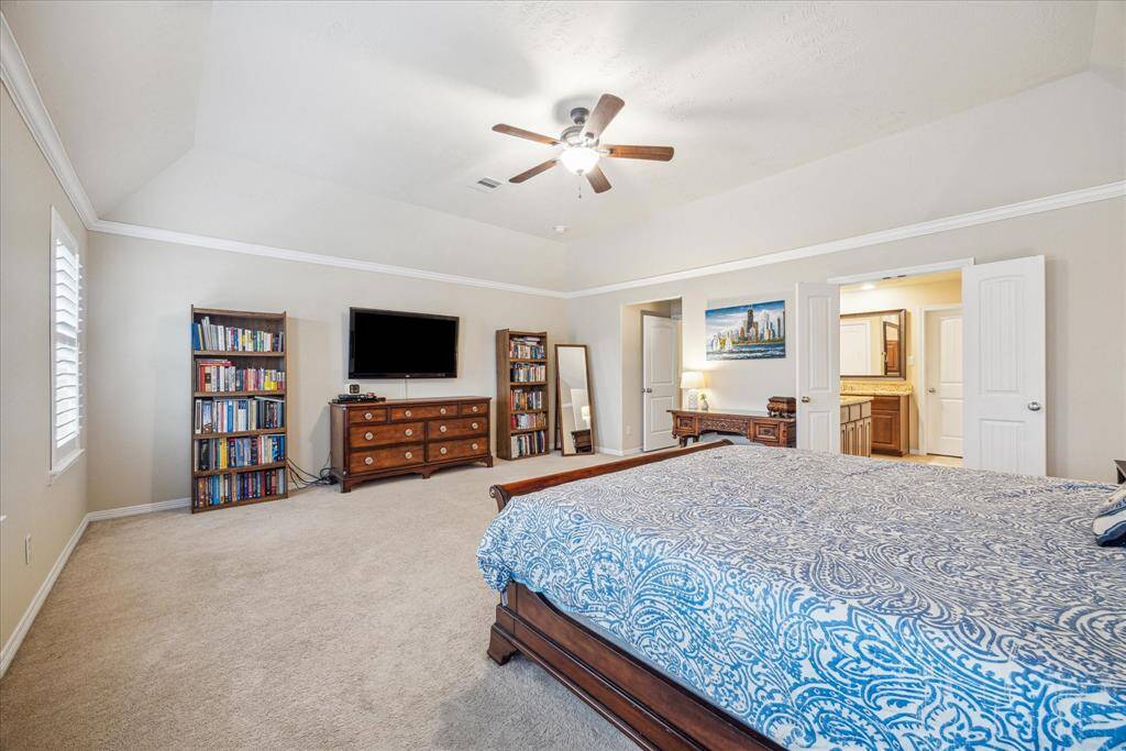 The primary bedroom is spacious enough to accommodate a sitting area.