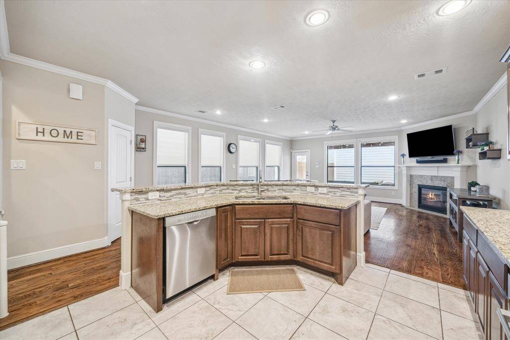The kitchen features a spacious island that overlooks the family room, along with a convenient corner pantry.