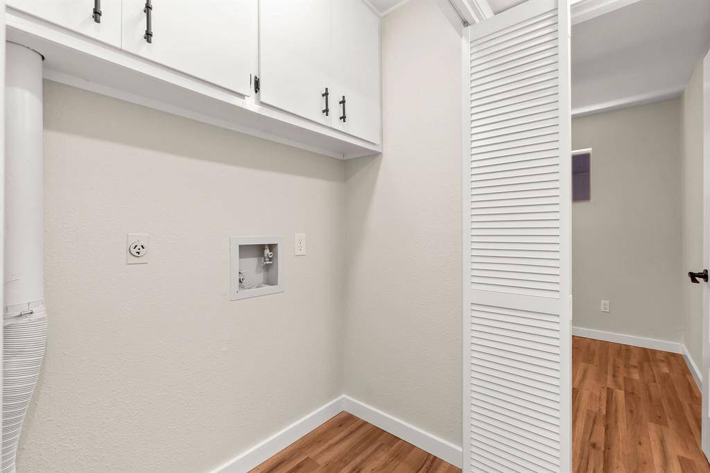 The utility room is equipped with washer and electric dryer hookups.