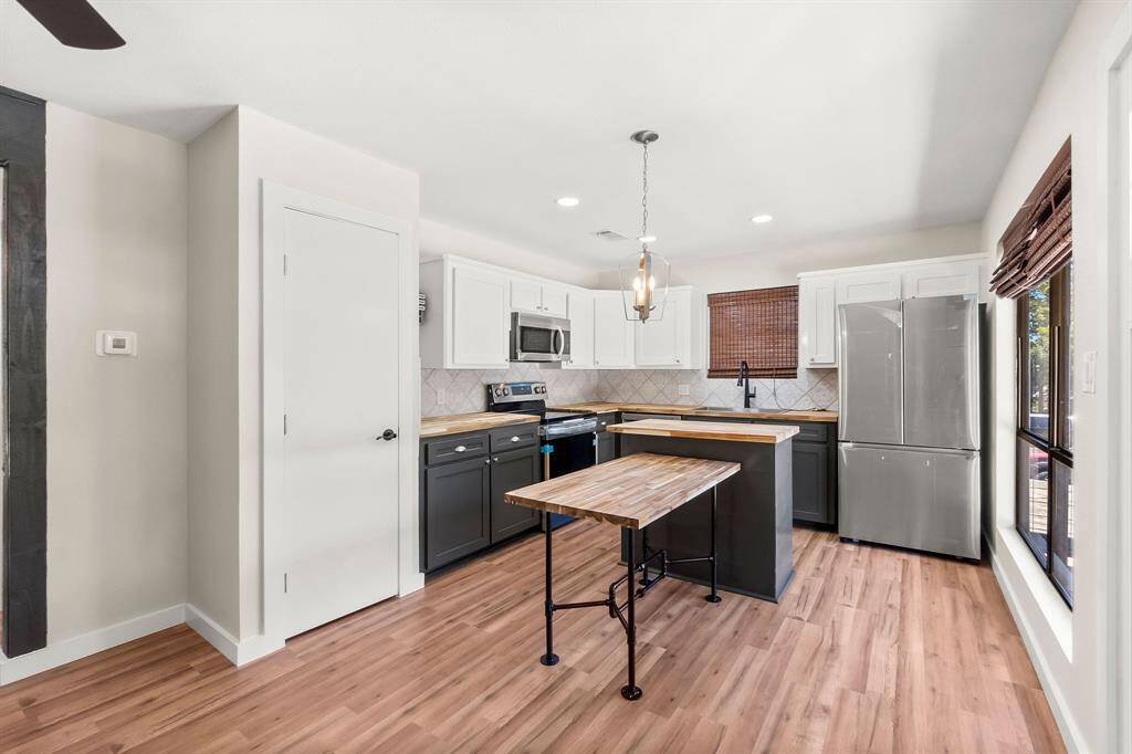 The home has been completely remodeled including an efficiently designed kitchen with butcher block counters and a convenient center island.