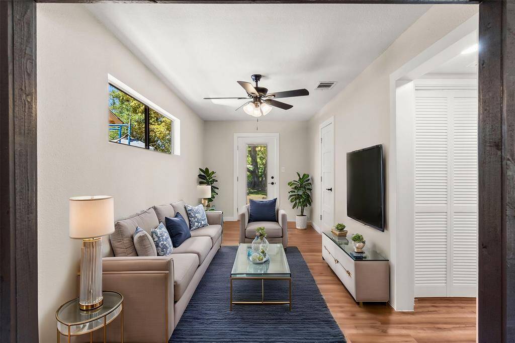Virtually staged - the living room area walks out to the back deck/yard