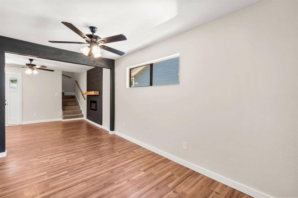 The home has vinyl plank flooring throughout the main living area