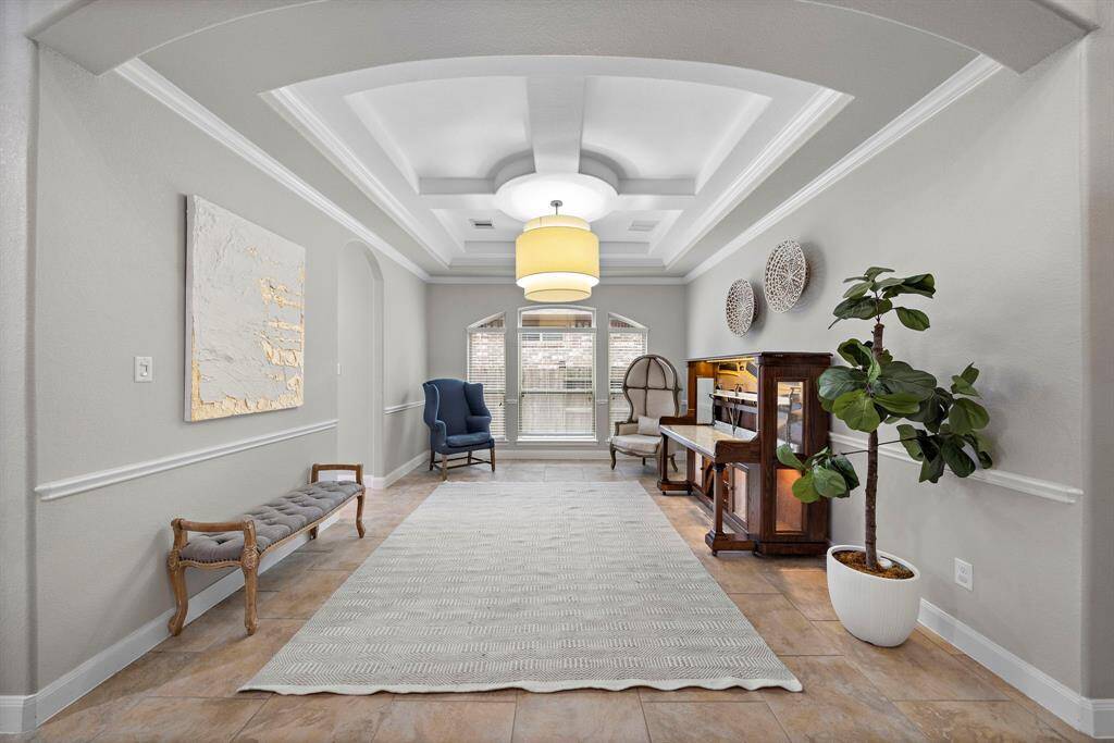 The spacious dining room features premier lighting and an ideal for any gathering.