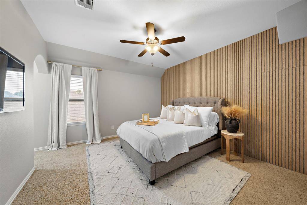 This secondary bedroom may be one of the best rooms. This room features a custom wall that has a hidden gem on the other side. Dedicate bathroom plus walk in closet.