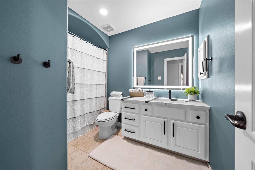 All secondary bathrooms present custom marble countertops, mirrors and cabinet hardware to complete the luxury look.