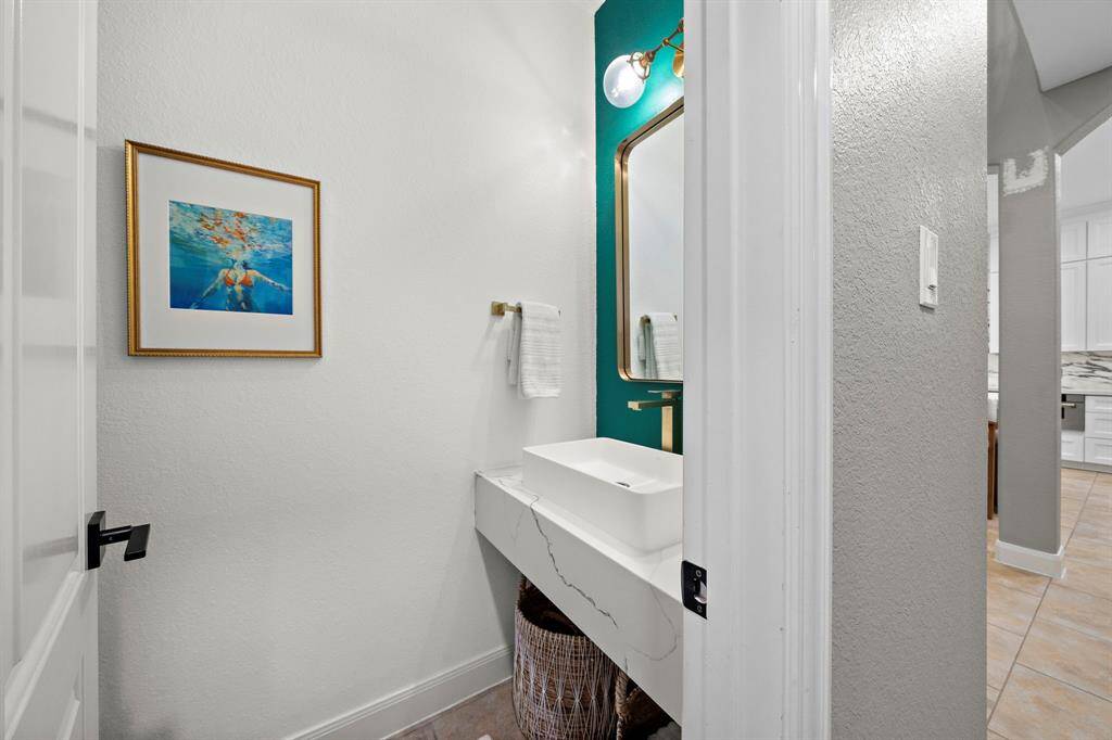 The guest bathroom on the first floor presents a fun and elegant look and feel.