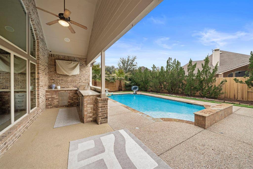 The mature landscaping allows for privacy and a beautiful backdrop.