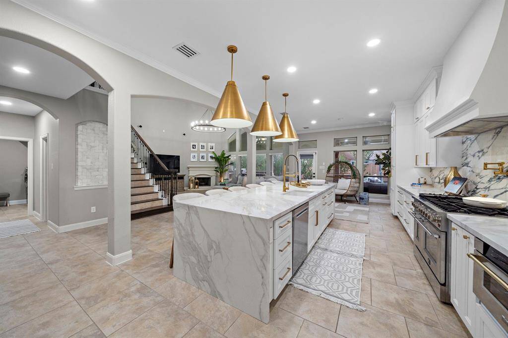 This masterpiece boasts soaring ceilings, open-concept design, and top-tier affiant finishes