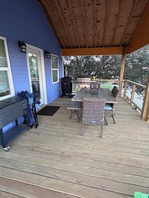 Deck that spans the back of the house is partially covered. Built  well, so it can be enclosed as additional living space