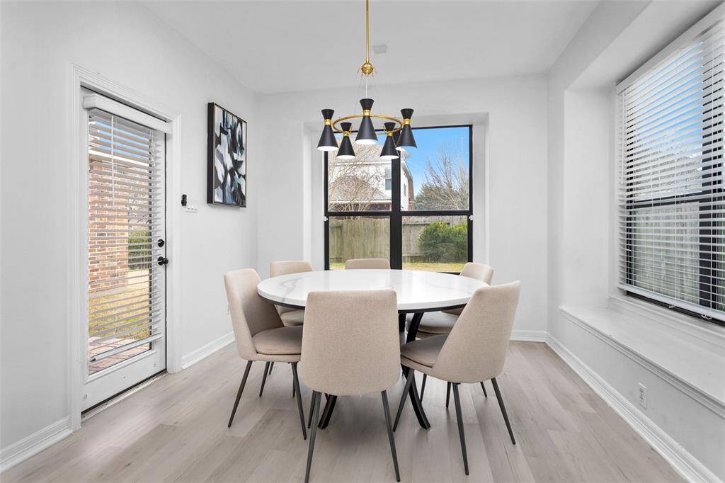 The breakfast room off the kitchen allows for a large table and extra seating.