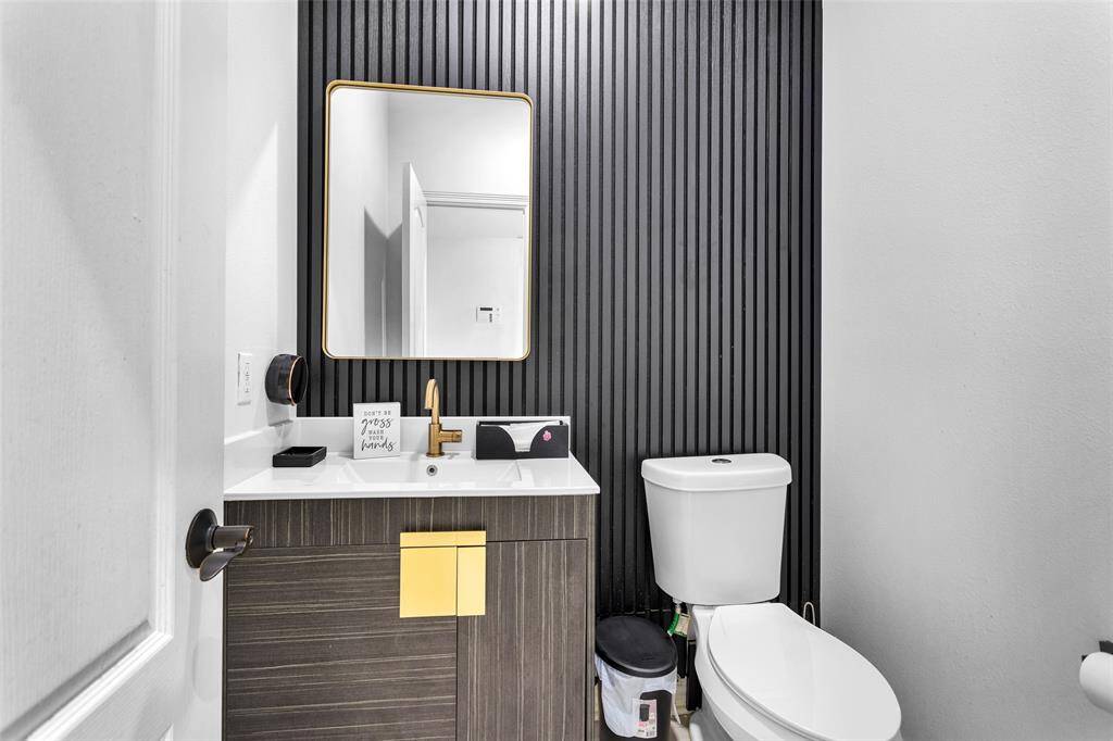 The updated half bathroom located downstairs.