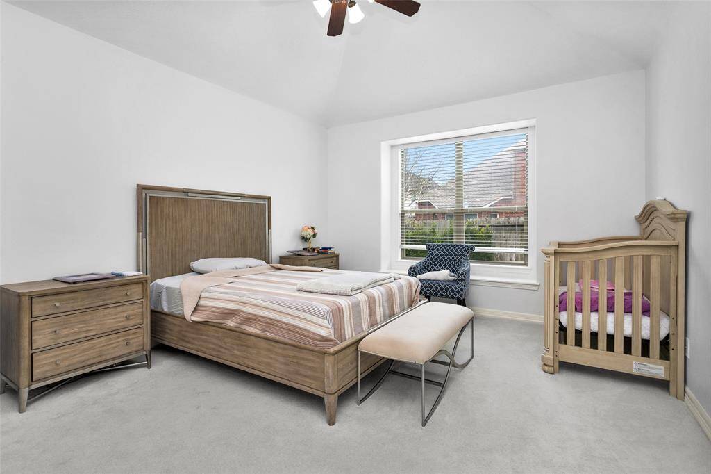 Primary bedroom is quiet and tucked into the rear of the home.