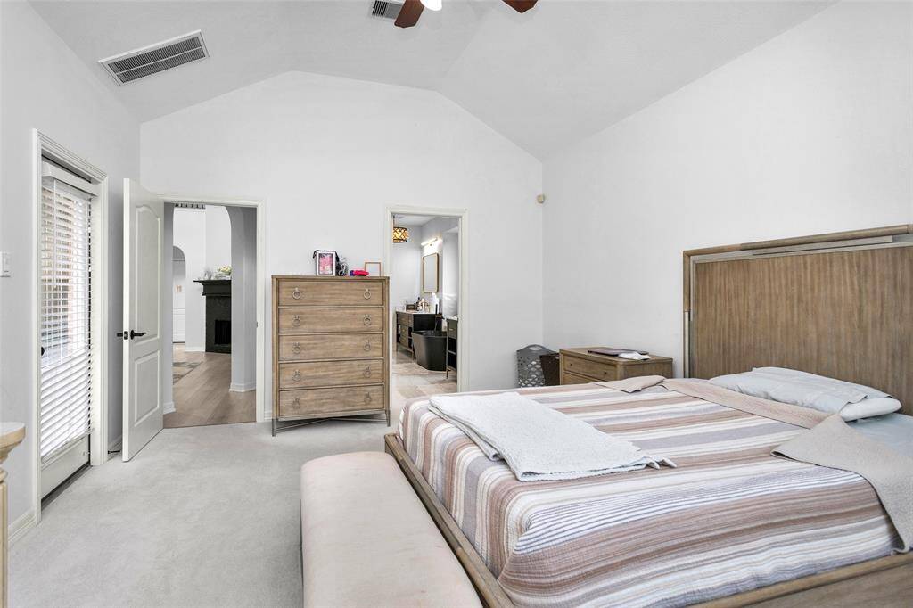 The primary bedroom is located on the 1st floor with high ceilings continuing through.
