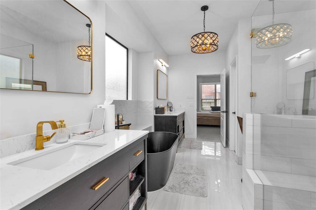 The ensuite bathroom boasts double vanities.