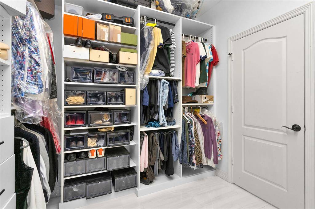 Primary walk-in closet.