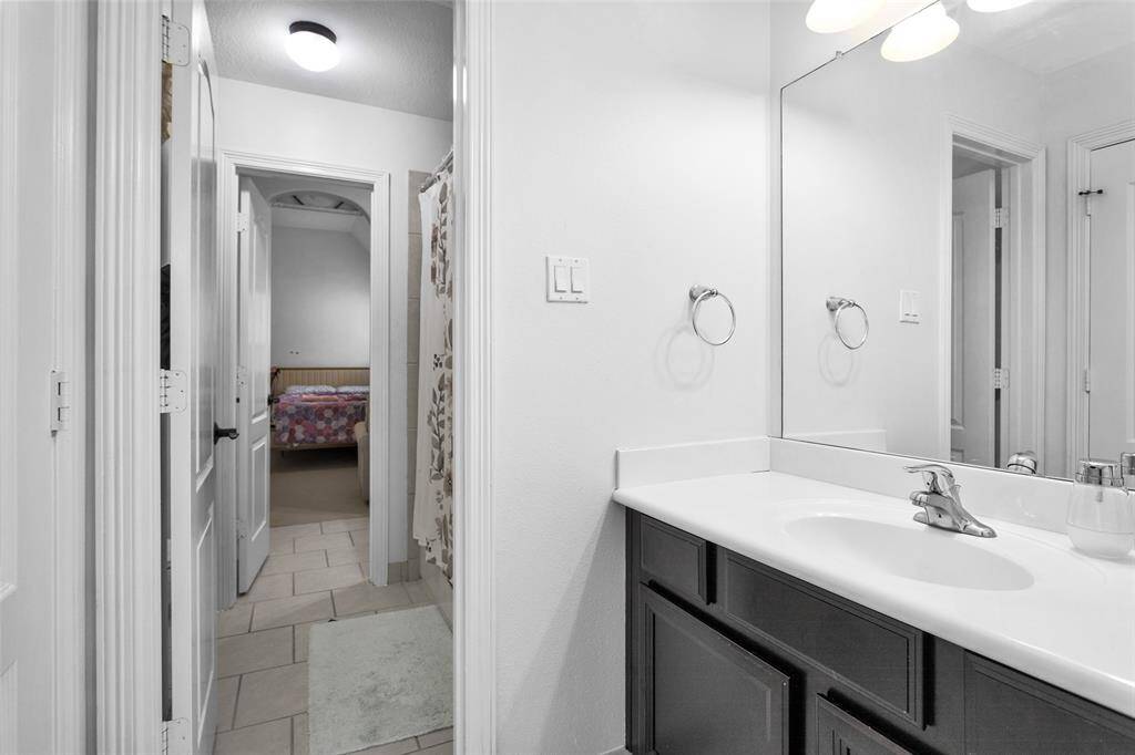 Second and third bedroom connect with a large full bathroom.