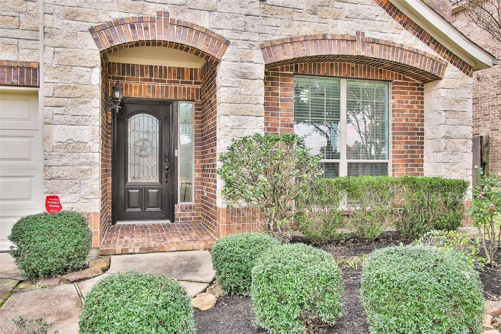 Front yard features Texas landscaping that is easy to maintain.