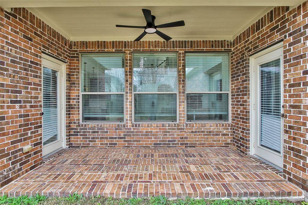 Covered patio with newly installed outdoor fan.