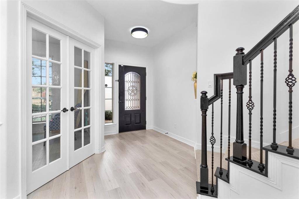 French doors, just off the foyer, welcome you to the home office/study.
