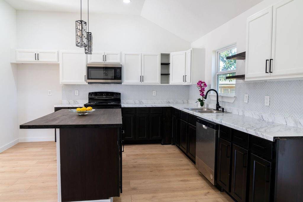Functional kitchen island, providing extra prep space and a modern touch to the layout.