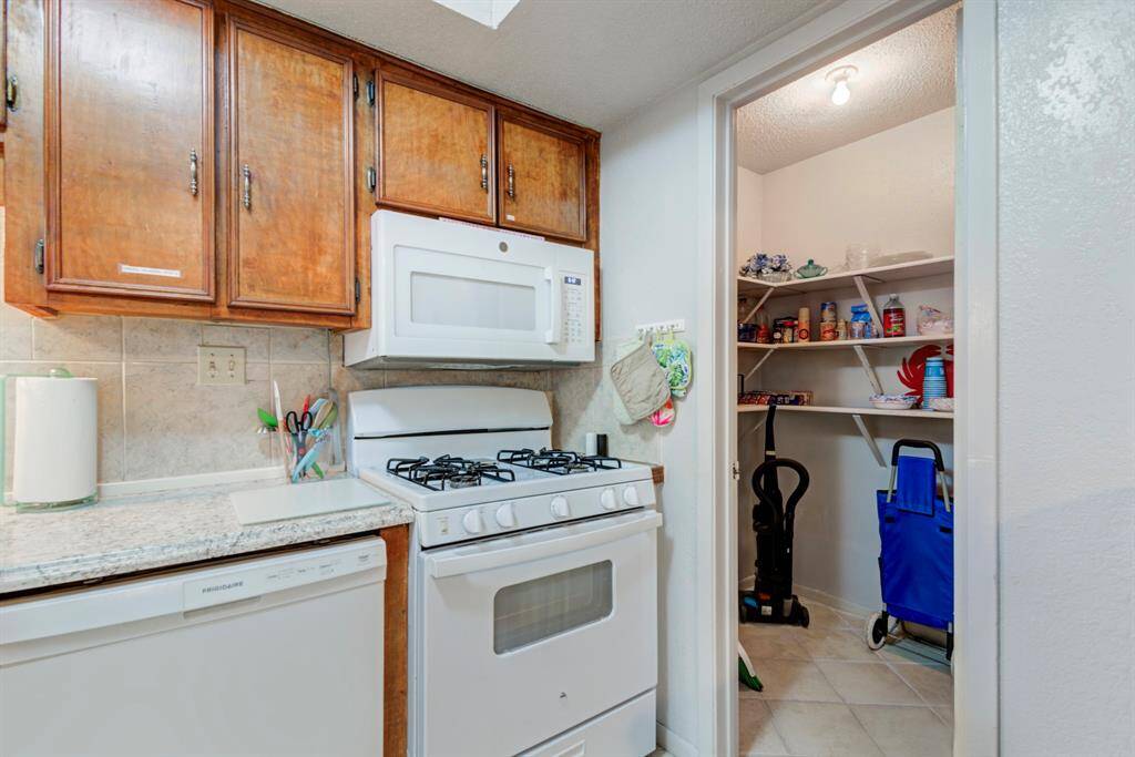 Don't let this charming kitchen fool you! The pantry is a large walk-in pantry.