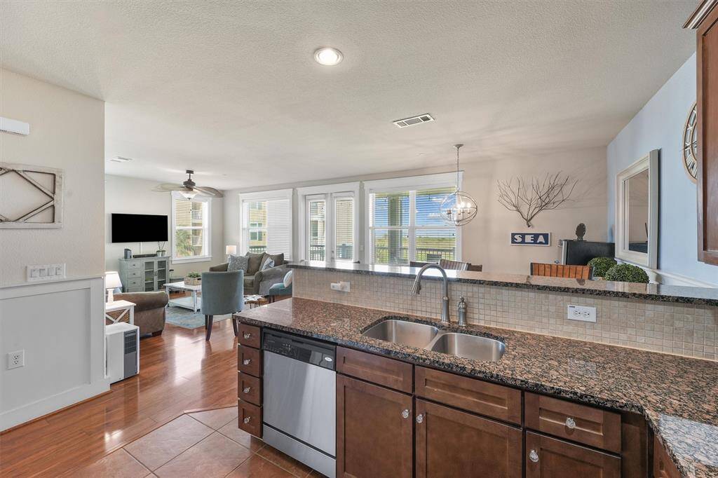 From the kitchen, you can see into the bright and airy living room, creating a cohesive and open living space. The kitchen's design ensures that it remains the heart of the home, connecting seamlessly with the main living areas.